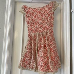 Orange colored dress with cream lace overlay